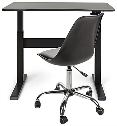 Pneumatic height adjustable standing desk can be used while sitting 